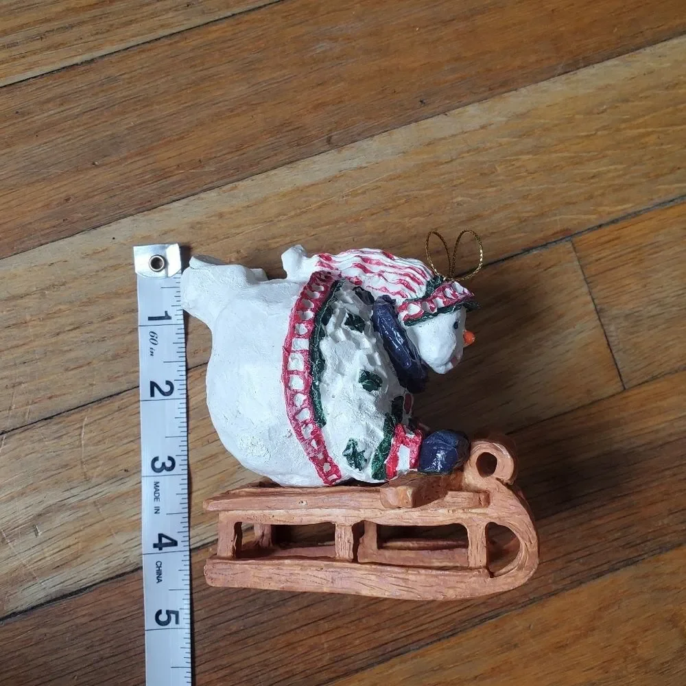 Round large snowman on sled Christmas tree ornament‎